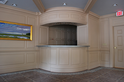 Raised Panel Wainscoting at the Delamar Hotel in Southport Connecticut.  The wainscoting is painted beige