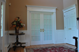 Beaded Raised Panel Wainscoting with Recessed Wainscoting Pediment Heads and Pilasters for Doors in Closter New Jersey NJ