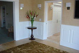 Classic Raised Panel Wainscoting with Pediment heads molding at doorway