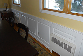 Wainscoting classic raised panel in a dining room in Glen Head Long Island New York.  Wainscoting Ideas by Wainscoting America