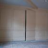 Full Wall Raised Panel Wainscoting with Hidden Door