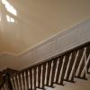 Classic Raised Panel Wainscoting on a Staircase with a landing.