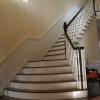 Grand Staircase with mahogany treads and custom raised panels.