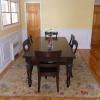 Classic Raised Panel Dining Room in Glen Head Long Island, NY.  This wainscot panel is custom made to incorporate the hot water radiator.  The panel is painted white and the walls are painted yellow