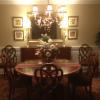 Classic Raised Panels in a Dining Room in Stamford, CT.  The wainscoting is painted white with Benjamin Moore Satin Impervo Paint.  The walls are painted an olive color.  The dining room table set is mahogany 