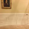 Benjamin Franklin Portrait hangs above curved wainscoting and hidden door.  Replica Office by Oval Office Design LLC.