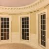 Curved Raised Panels between Windows in Oval Office.  Replica Office by Oval Office Design LLC.