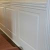 Raised Panel Wainscoting in a long hallway.  For wall lengths longer than 8 Feet there will be a lap joint seam along one of the vertical stiles.