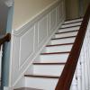 Staircase Raised Panel Wainscoting.  Notice how the raised panel stops 1 inch from the corner so that the top cap can wrap around panel and not stick out past the corner.