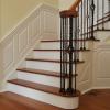 Classic Raised Panel Staircase with Column and custom triangle panel in foyer. Installed in Wolcott CT.