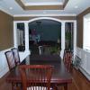 Raised panel wainscoting in a dining room located in Oakdale, Long Island, NY.  The panels are installed on top of the baseboard radiator.