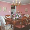 Classic wainscot paneling in a dining room in Fairfax, VA.  The panels are painted white and the walls are painted pink.