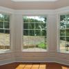 Bay Window with Pediment Head and Raised Panel Wainscoting